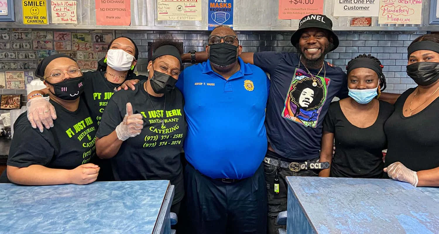Tony Vauss visiting a local business with community members